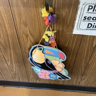 a toucan hanging on a door