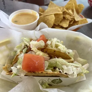 Chicken tacos, chips, and queso
