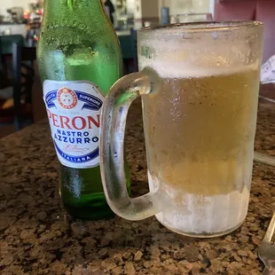 a glass of beer and a bottle