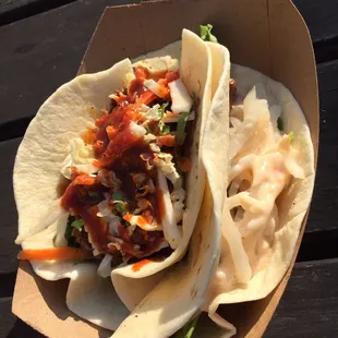 two tacos on a table