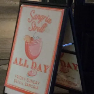 a sign with a drink on it