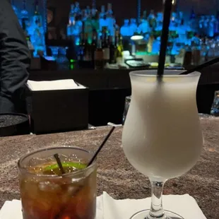 a drink and a glass on a table