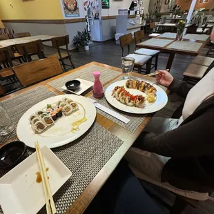 (Left to right)   Spicy tuna roll, salmon roll, spicy salmon roll, spider roll, lion king roll