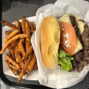 Double burger with cheese and sweet potato fries.