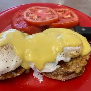 Crab cake Benedict with sliced tomatoes