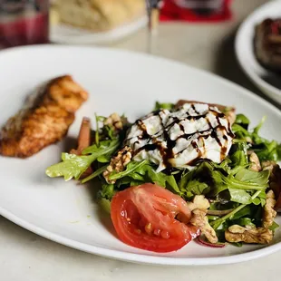 Blackened salmon salad with arugula &amp; burrata.