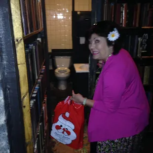 Fake book wall opens up to the bathroom. Thought it was cool and cute.