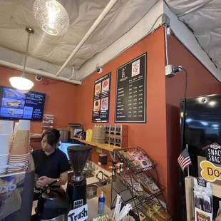 a woman standing in front of the counter