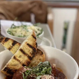 Tower 12 Italian Meatballs and Arugula Fennel Salad with garlic bread