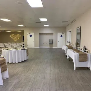 Dessert, cake and present tables. Good view of the nice bathrooms