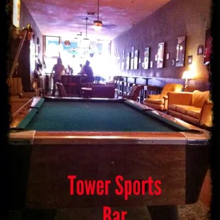 a pool table in the middle of the room