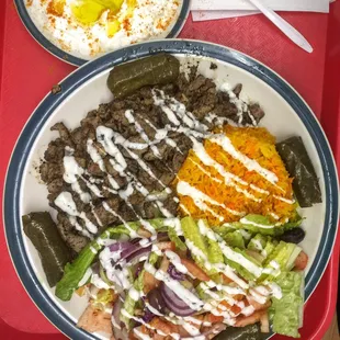 two plates of food on a red tray