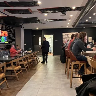 people sitting at the bar