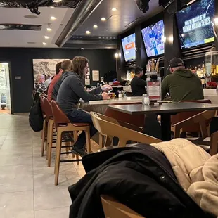 people sitting at the bar