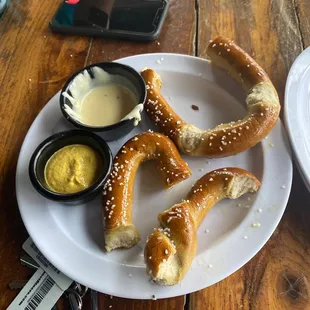 $5 pretzels (2) during happy hour with cheese and mustard. Very chill place, would come back.