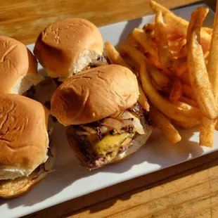 a plate of hamburgers and fries