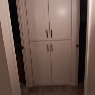 Shaker style hallway linen closet doors