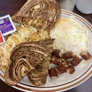 Over easy eggs, sausage links, hash browns and rye toast.