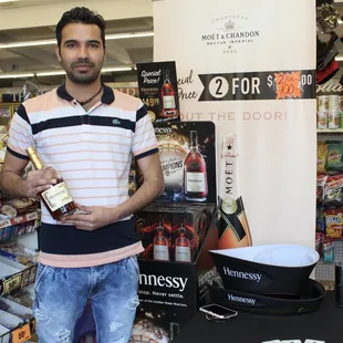 a man holding a bottle of wine