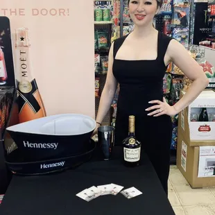 a woman standing in front of a table