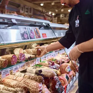 a man selecting sausages