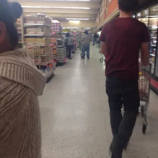a woman pushing a shopping cart