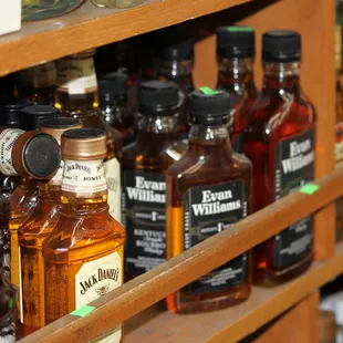 a shelf of liquor bottles