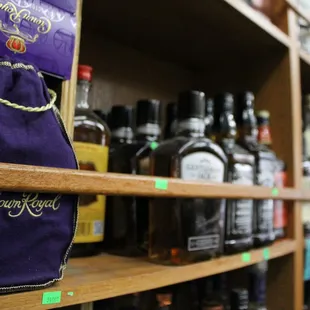a shelf of liquor bottles