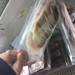 a person holding a banana in a bag