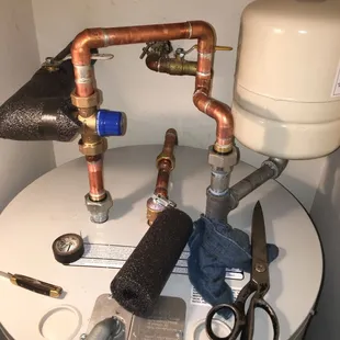 We upgraded a water heater installation adding a tempering valve and other things.