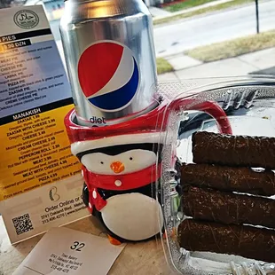 a can of pepsi and a penguin