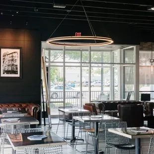 a dining area with tables and chairs