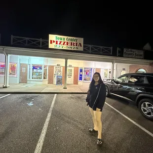 a woman in a parking lot