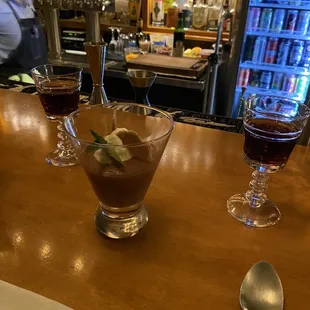 two glasses of wine and a spoon
