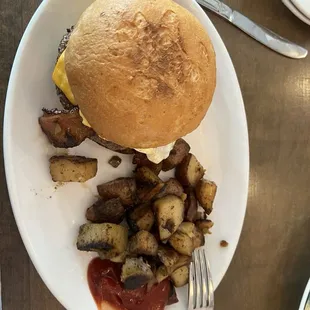 Breakfast burger with a gluten-free bun and house potatoes- $14.00