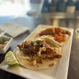 Featured taco, Thai chill and walleye taco in the back