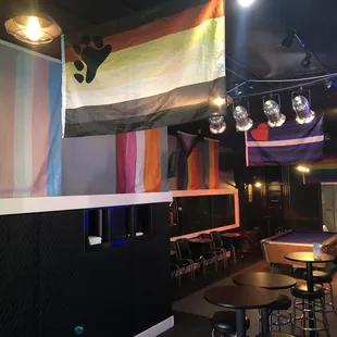 a rainbow flag hanging from the ceiling