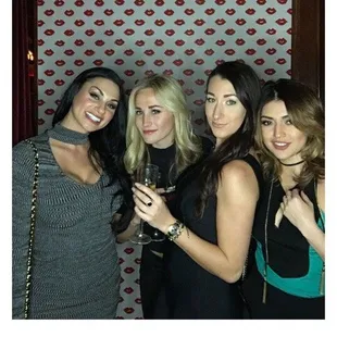 a group of women posing for a picture