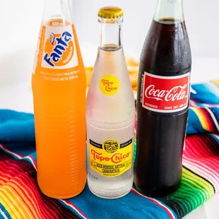 a variety of sodas and soft drinks