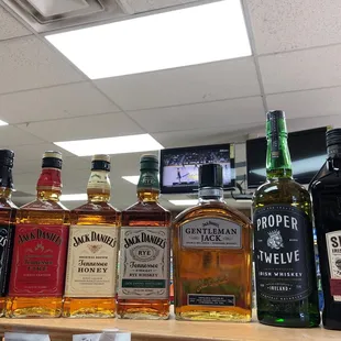 a variety of liquor bottles on a counter