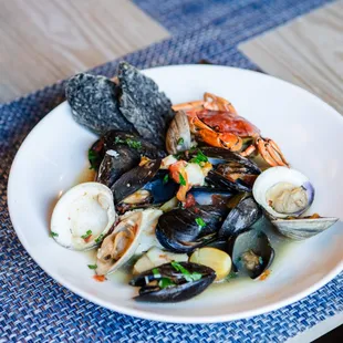 Bouillabaisse made with
Scallops, Clams, Mussels, 
Squid Ink Soda Bread, Rouille