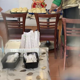 Fresh pork buns just cooked, Also self serve utensils station