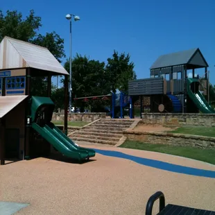 Two old country town theme play structures.