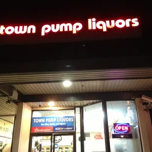 a neon sign above the door