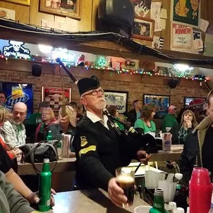 a group of people sitting at a bar