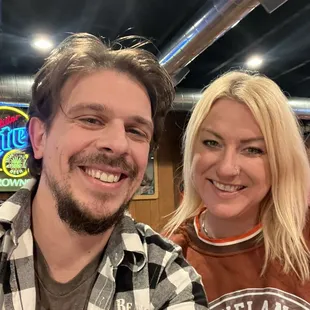 a man and a woman sitting at a table