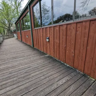 a wooden walkway leading to a restaurant