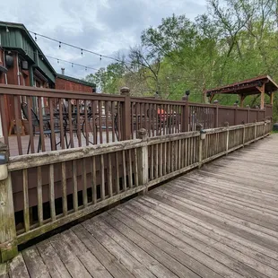 a wooden deck overlooking a wooded area