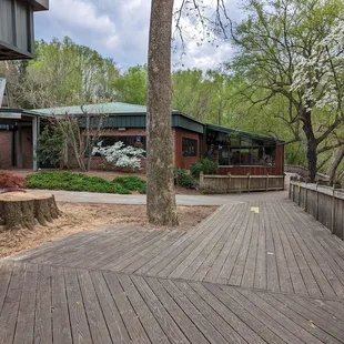 a wooden walkway leading to a restaurant