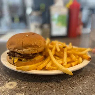 a hamburger and fries on a plate